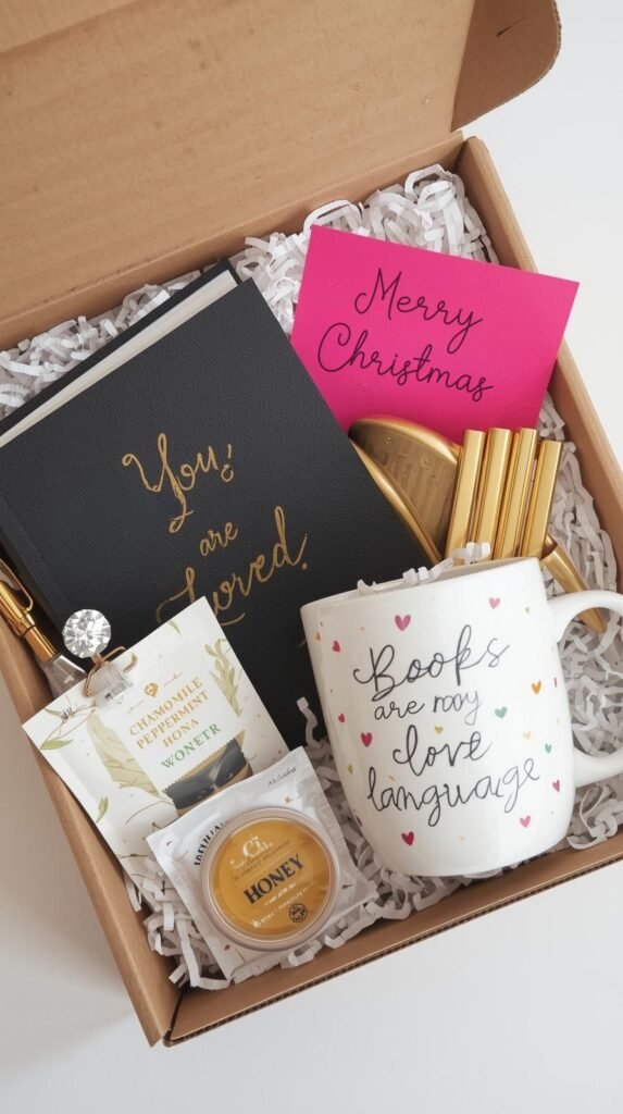 A thoughtful self-care gift box arranged neatly with cozy and motivational items.
