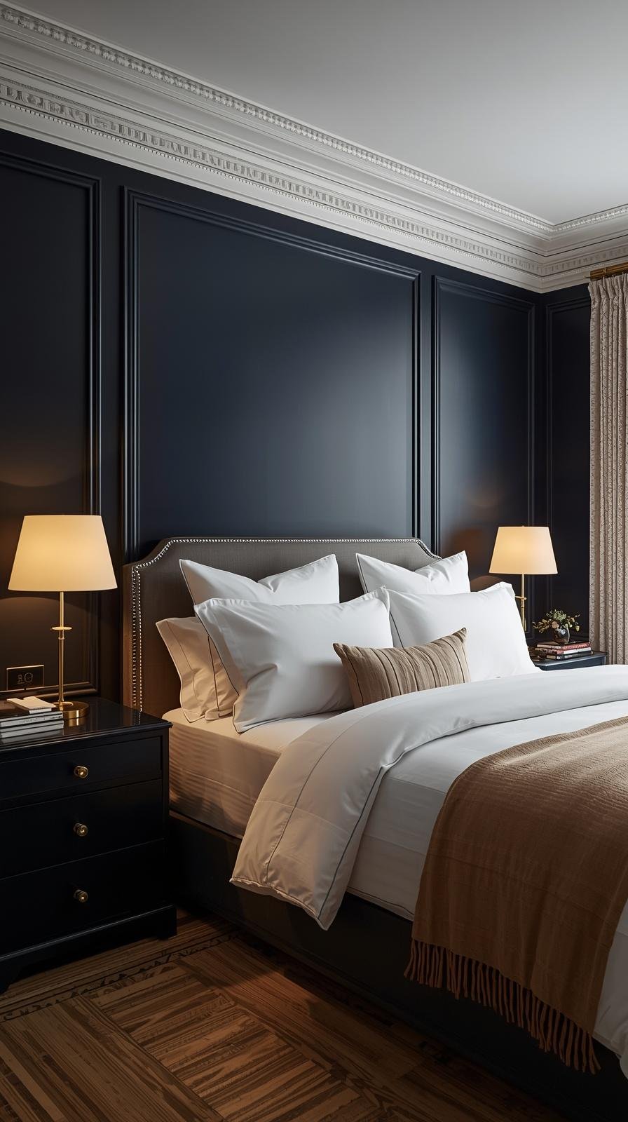 Bedroom with deep navy blue walls, white bedding, and brass accents creating a sophisticated retreat -Bedroom Paint Ideas