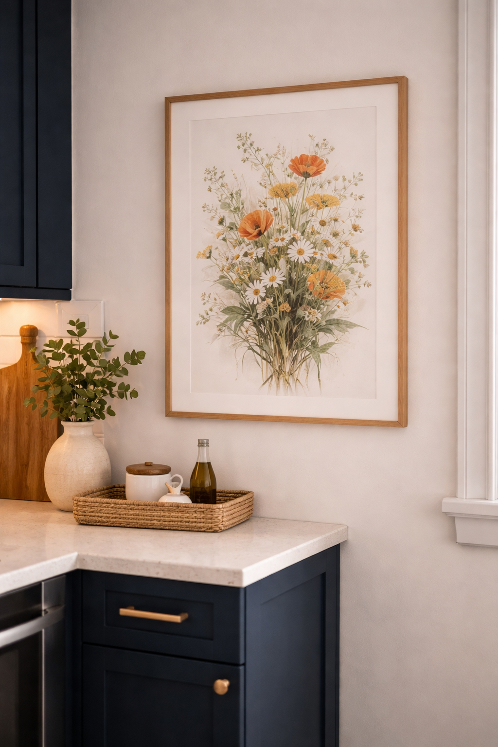Kitchen wall with a large botanical art print in a simple frame hung above the counter adding personality