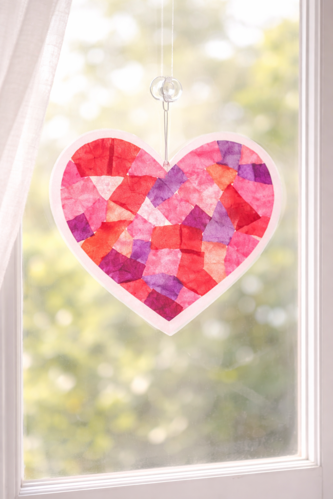 Colorful heart-shaped suncatcher in sunlight